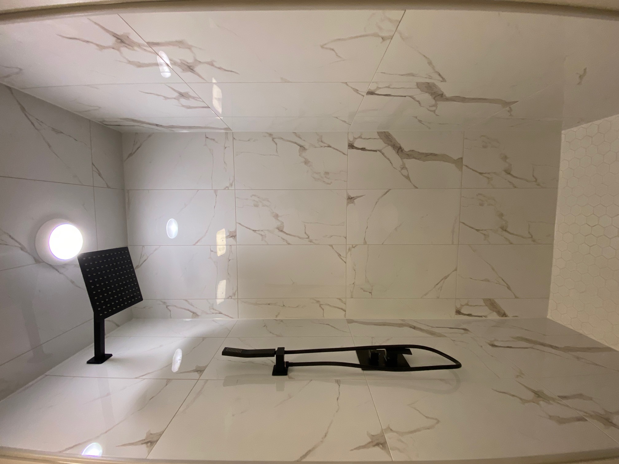 Finished bathroom shower tile in garage conversion ADU in Clarington, Ontario